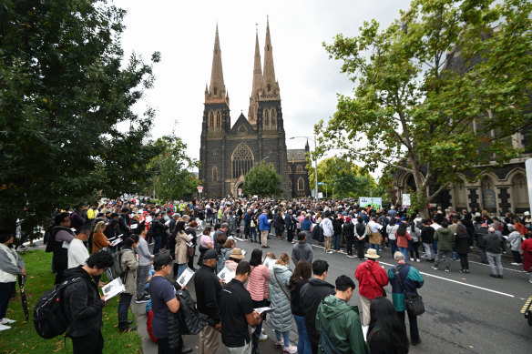A crowd outside St Patrick’s Cathedral in Melbourne on Good Friday.