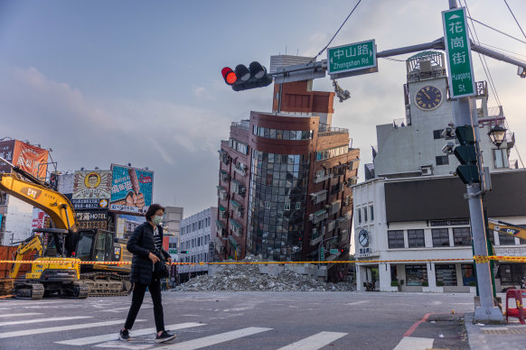 A person walks past an area cordoned off following the earthquake in Hualien, Taiwan.