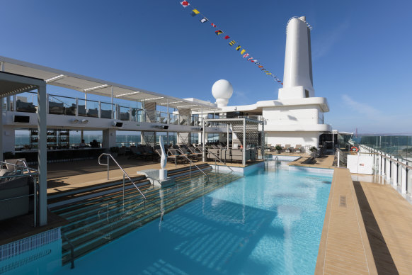 The pool deck with its cabanas and central bar.