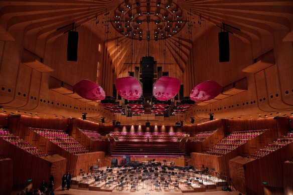 The Sydney Opera House’s Concert Hall. now has “petals” that replace the old plastic”doughnuts” above the orchestra stage following a refurbishment.