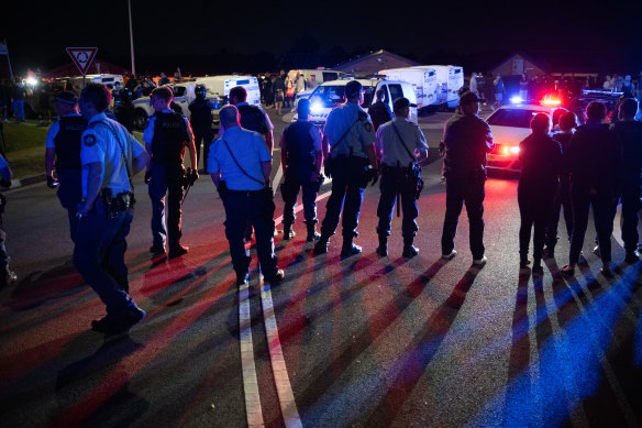 Police are out in force to quell growing crowds in Wakeley following the stabbing.