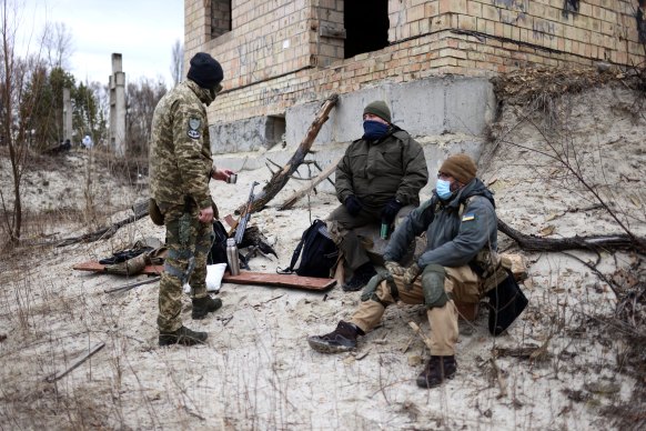 Members of Ukraine’s defence forces take a break from training. 