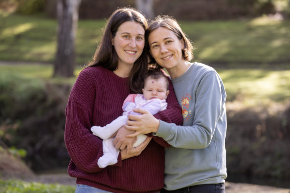 Claire Sara and Nina McCann with their baby, Emily. Sara was eligible for Medicare-funded IVF because she had a burst appendix. 