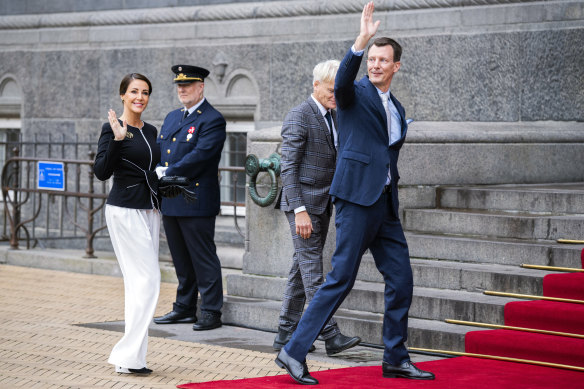 Denmark’s Prince Joachim, right, and Princess Marie wave as they arrive at Copenhagen City Hall for the City’s celebration of Queen Margrethe’s 50th ruler jubilee last month.