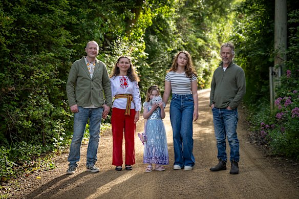 Mark Corrigan (far right) with his neighbours Tetiana and Oleksandr Tkachuk and their daughters Sophia and Kateryna. 