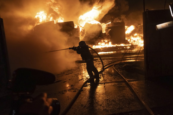 Firefighters extinguish a fire after a Russian attack on a residential neighborhood in Kharkiv, Ukraine.