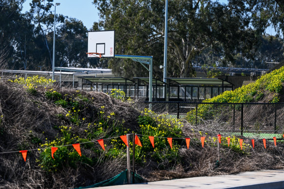 Mounds of dirt and temporary fencing still surround the netball courts. 
