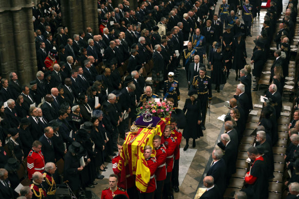 The royal family follow the Queen’s coffin in procession.