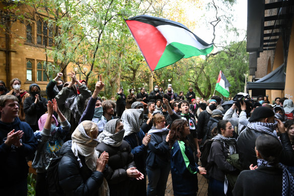 Students rally at the pro-Palestine encampment at the University of Melbourne on Friday.
