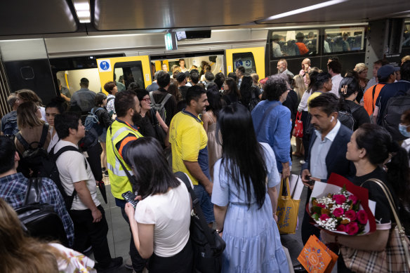 Commuters wait for delayed trains at Town Hall.