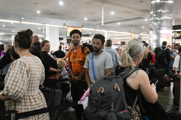 Ben Kroone (centre right) was on the Jetstar flight to Bali that was turned around.