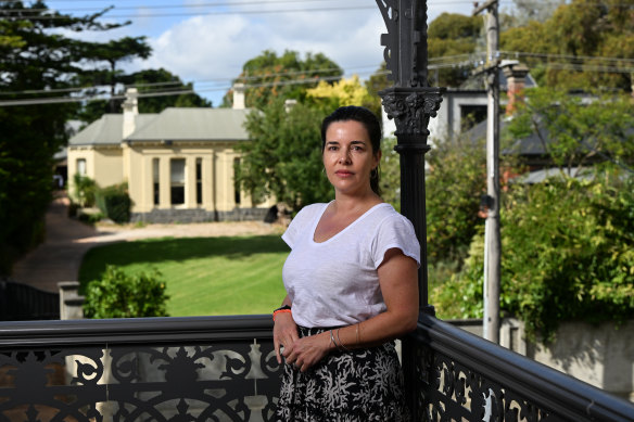 Anna Prenc is among a group of Hawthorn residents fighting to stop the redevelopment of 76 Wattle Road, seen in the background.