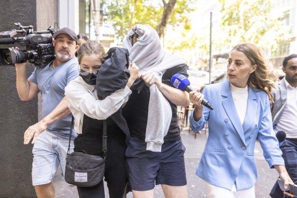 Matthew Raoul White  leaving court with the woman he blew kisses to in court.