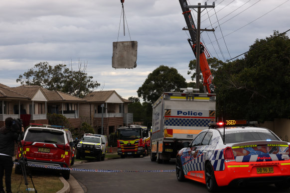 A crane moving cement away from the site of a gas explosion in the western Sydney suburb of Whalan.