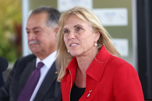 Cindy Hook, pictured with Brisbane 2032 president Andrew Liveris in 2022, is departing the Games organising committee.