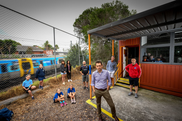 Students at Brighton Primary School learn in ageing portables. The school community, led by council president Andrew Campbell (centre), has developed a master plan for a rebuild.