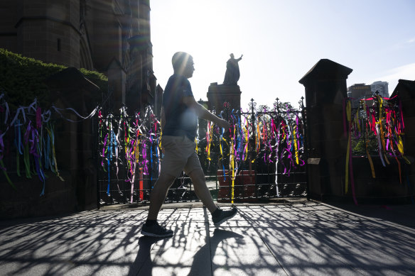 Victims tie ribbons outside St Mary’s Cathedral, Sydney, where George Pell lay in state.