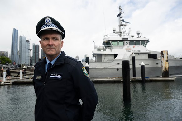 Superintendent Joe McNulty head of the Marine Area Command. Behind him is the police vessel Nemesis.