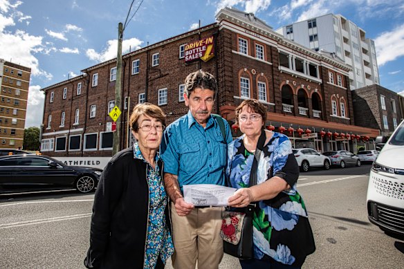 Burwood Historical Society president Chery Kemp with fellow members Paul Roper and Katie Kershaw pictured outside the Strathfield Hotel.
