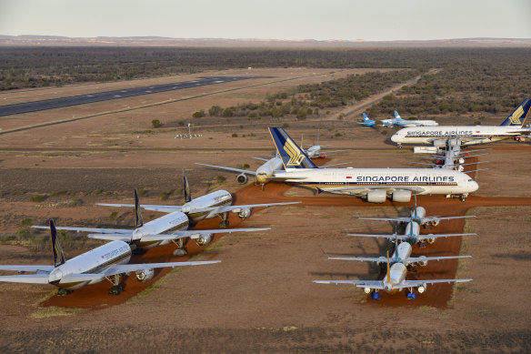 Aircraft emissions have dived as aeroplanes have been grounded all over the world. Pictured here are planes at a storage facility in Alice Springs.