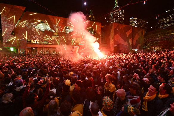 Crowds gather at Federation Square to watch the Matilda’s play England in the World Cup.