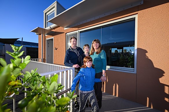 Ruth Giles at her three-bedroom apartment with husband Rob and children Nova and Peter.