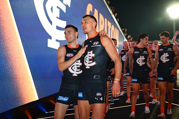 For young and old: Jagga Smith and Patrick Cripps take the Blues from the air to their rooms to sing the song.