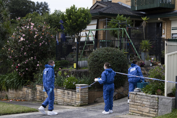 Police officers at the Marsfield home on Thursday.