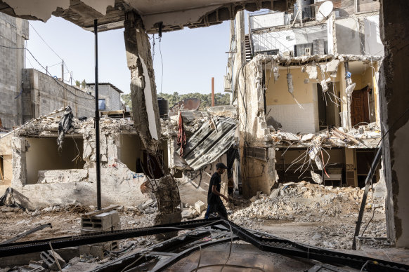 A man walks among the destruction after a more than 50-hour Israeli military operation in the northern West Bank’s Nur Shams refugee camp.
