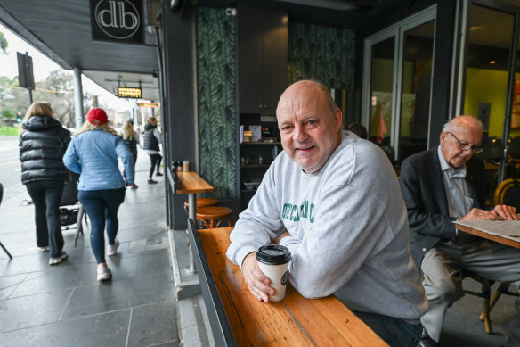 Billy Brownless drinks coffee at Domain Brasserie