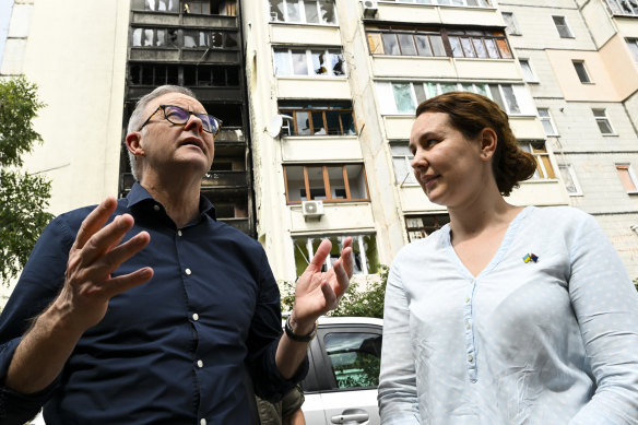 Australian embassy staffer Nadia Teriokhina talks to Prime Minister Anthony Albanese near her destroyed house in Irpin: “We were one of the lucky ones.” 