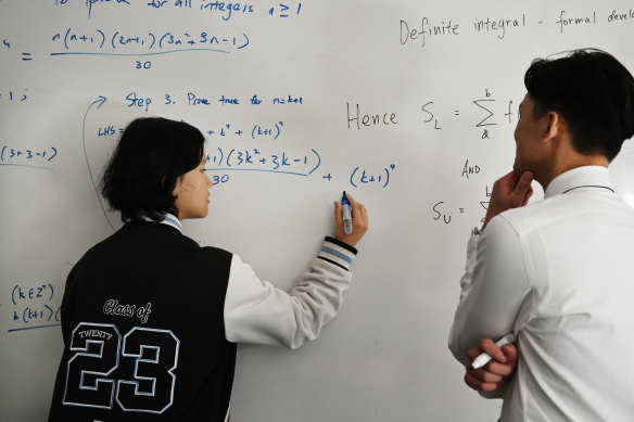 Two HSC maths students from Conservatorium High in Sydney’s CBD work on a problem.