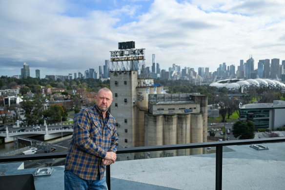 John Molden lives in an apartment tower next to the Nylex clock silos, which sit empty and abandoned.