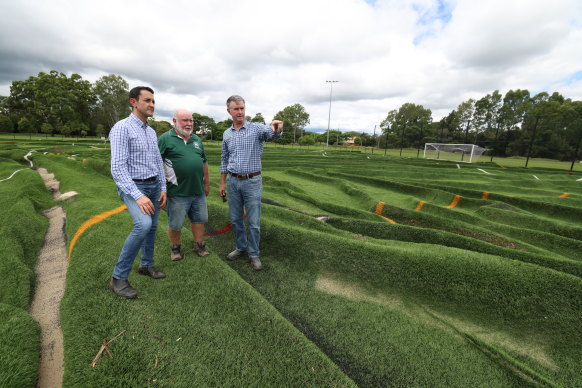 David Crisafulli (left) inspecting the damage at Mitchelton FC earlier in the week, with club president Gary Green and LNP MP Tim Mander.