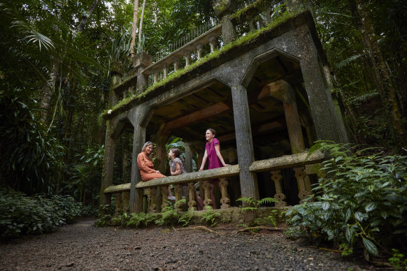 You can visit a 1930s castle flanked by gardens and lush rainforest at Paronella Park.