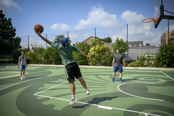 Shooting under the midday sun in the town where Wemby grew up are (left to right) local players Hugo Zeitter, Victor Lentz, and Julien Plouvier, who love the acclaim their home town hero has won.