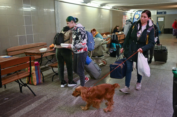 People, mainly women and children, arrive at Przemysl train station after journeying from war-torn Ukraine on March 30.