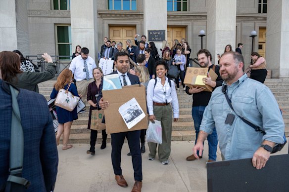Members of the Pentagon press corp carry their belongings out of the Pentagon in October after the implementation of severe restrictions on the press.