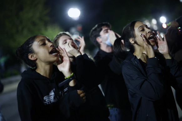 Demonstrators gathered outside the US Supreme Court to protest after news of the leak broke. 