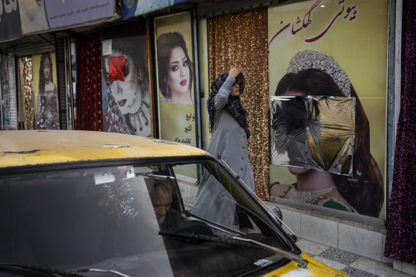 Many beauty salons in Kabul have been defaced or covered up to remove images of women.