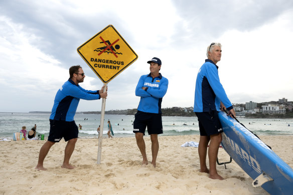 Lifeguards Troy Storm Quinlan, Bruce “Hoppo” Hopkins and Tommy Woodriff at Bondi Beach. A new report calls for better coverage at dangerous, unpatrolled beaches. 