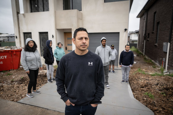Pratap Chitrakar (middle) is one of a dozen clients of the building co<em></em>ntractor Sippy Grewal. He estimates o<em></em>nly 70 per cent of the co<em></em>nstruction is complete.