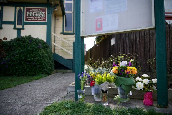 Floral tributes left outside Korumburra Baptist Church for the victims.