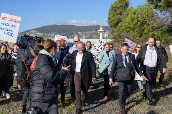 Protesters surround Prime Minister Anthony Albanese after he announced funding for a new stadium in Hobart.