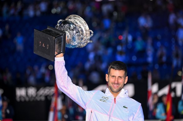 Novak Djokovic lifts the Australian Open trophy for a 10th time.