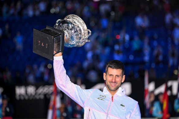 Novak Djokovic lifts the Australian Open trophy for a 10th time. 