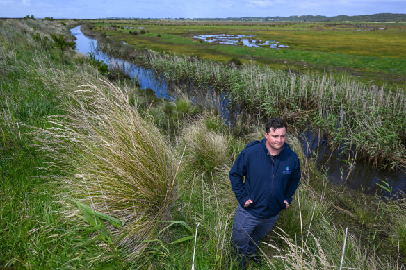 South Gippsland Shire mayor Nathan Hersey at one of the levee walls in Venus Bay. 