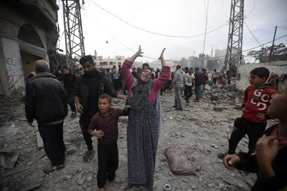 A Palestinian woman gestures following Israeli airstrikes in Khan Younis refugee camp.