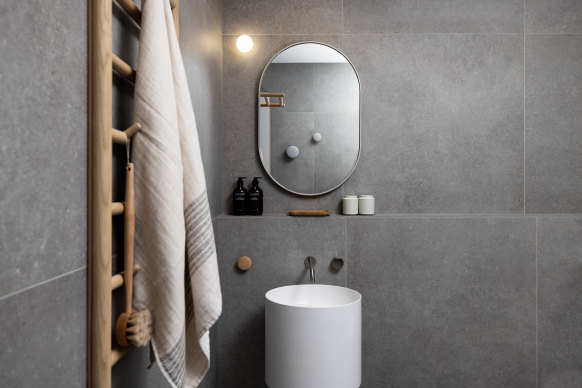 The bathroom features a walk-in rain shower.