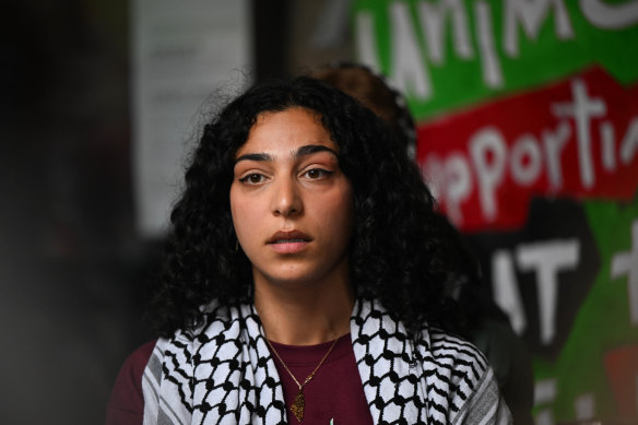 University of Melbourne protest leader Dana Alshaer addresses the media outside the Arts West building on Friday afternoon.